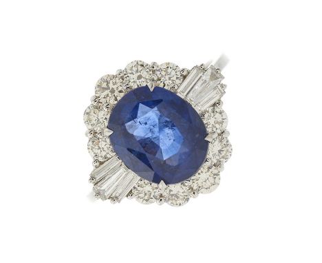 An 18ct gold sapphire and diamond cluster dress ring, with brilliant-cut diamond partial surround and tapered baguette-cut di