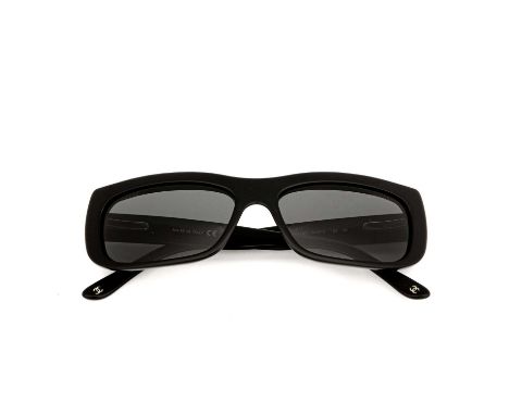 Chanel, a pair of sunglasses, designed with black acetate frames, grey tinted lenses, and chain and interwoven leather detail