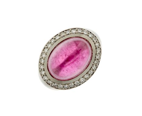 A palladium oval pink tourmaline cabochon and brilliant-cut diamond cocktail ring, with tapered and shaped band, tourmaline e