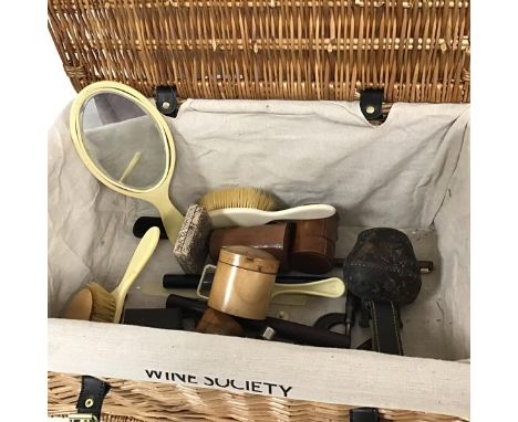 A mixed lot including a Wine Society wicker basket (24cm x 52cm x 35cm), a quantity of assorted items including hairbrushes, 