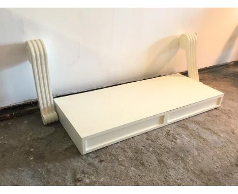 A modern white console table, the rectangular top fitted two frieze drawers, on chanelled corbel supports (h.80cm x 150cm x 6