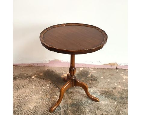 A modern Georgian style wine table, with piecrust edge, on turned support with tripod base (52cm x 38cm)