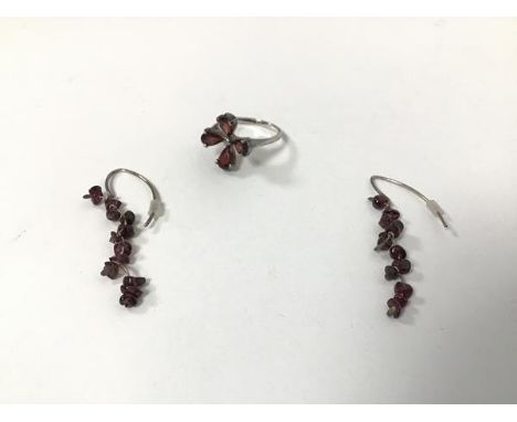 A silver garnet cluster ring with four stones (L/M) and a pair of drop earrings