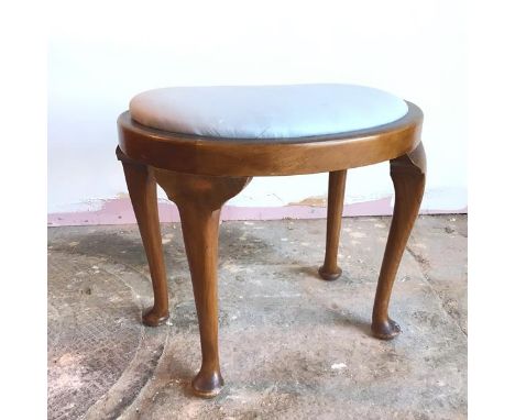 A kidney shaped footstool with light blue upholstered drop in top, on cabriole supports terminating in pad feet (46cm x 53cm 