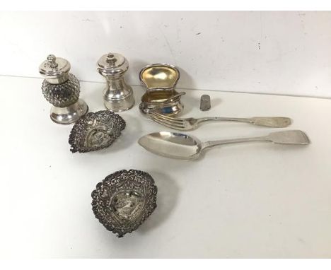 A collection of silver including an 1834 London silver serving spoon, a London 1799 silver fork, trinket dishes, condiment po