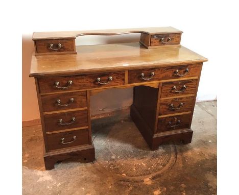 An Edwardian mahogany dressing table, lacking superstructure, fitted two frieze drawers above three short drawers to either p