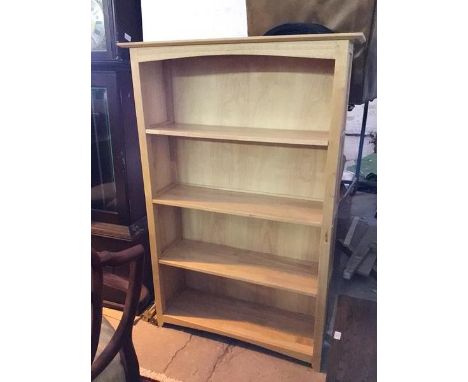 A modern light oak open bookcase fitted four shelves (150cm x 101cm x 33cm)