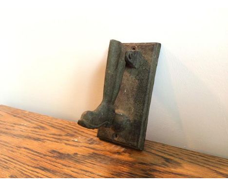 A vintage novelty door knocker in the form of a wellington boot (15cm)