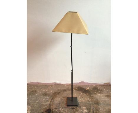A metal standard lamp with ball hinge lamp holder and two adjustable hinges to stem, on square base, complete with shade (143