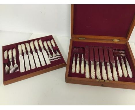 An Edwardian cutlery canteen with a set of twelve fruit knives and forks, with mother of pearl handles (canteen: 6cm x 29cm x