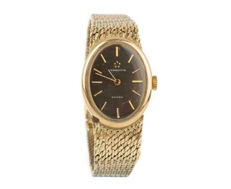 ETERNA NINE CARAT GOLD MANUAL WIND WRIST WATCH the oval dial with baton hour markers, 31mm case, on a nine carat gold bracele