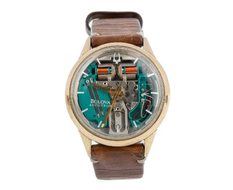 BULOVA ACCUTRON, GOLD PLATED WRIST WATCH  the round skeleton dial with baton hour markers to the acrylic, 34mm case, on a bro