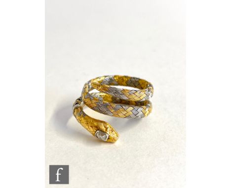 A yellow and white 18ct gold snake ring with single diamond set to the head, weight 5.6g, ring size approximately M. 