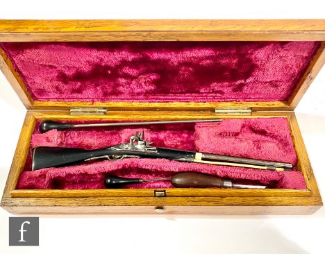 A miniature apprentice or sample tradesman musket, steel 10cm barrel with lock stamped C.S, ivory ram rod and ebony stock wit