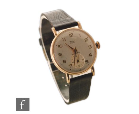 A gentleman's 9ct hallmarked Smiths Everest, manual wrist watch, gilt Arabic numerals to a silvered dial, diameter of case 36