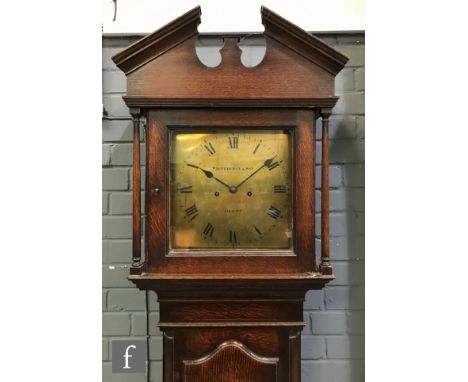 A 19th Century oak longcase clock the eight day brass movement by Whitehurst &amp; Son Derby enclosed by a glazed hood over a