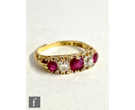 An early 20th Century 18ct ruby and diamond five stone ring, central ruby approximately 4.2mm, each diamond approximately 0.1