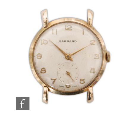 A gentleman's 9ct hallmarked Garrard wrist watch, Arabic numerals to a cream dial, case diameter 34mm, total weight 23.4g, Lo