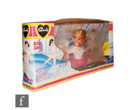 A 1970s Pedigree Sindy Active Sindy doll with original box complete with posing stand and free gift leaflet. 