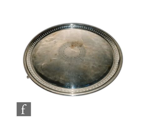 A 19th Century hallmarked silver circular salver with pierced leaf decorated frieze within beaded borders, engraved with a ce