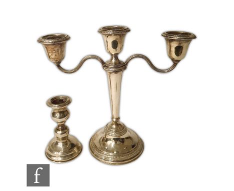 A hallmarked silver three light candelabra, circular stepped base below flaring column and circular capital, height 22cm, Bir