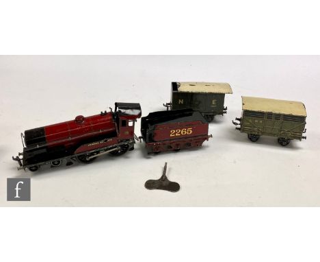 An O gauge Bassett-Lowke 4-4-0 LMS maroon 'Princess Elizabeth' clockwork locomotive and tender, with an NE covered van and an