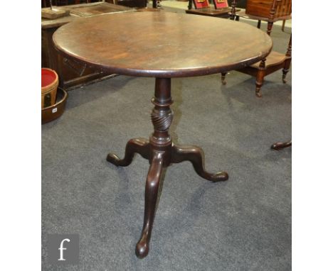 A George III circular mahogany tripod occasional table on turned wrythen pedestal and splayed tripod legs, diameter 72cm. 