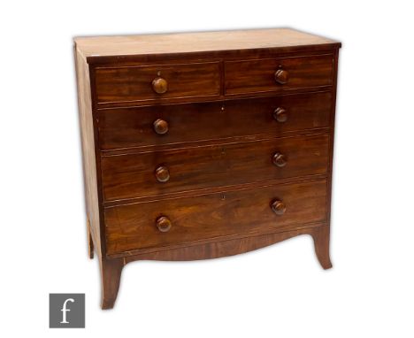 A George IV mahogany veneered chest of two short over three long drawers, raised to French bracket feet, the drawer fronts wi