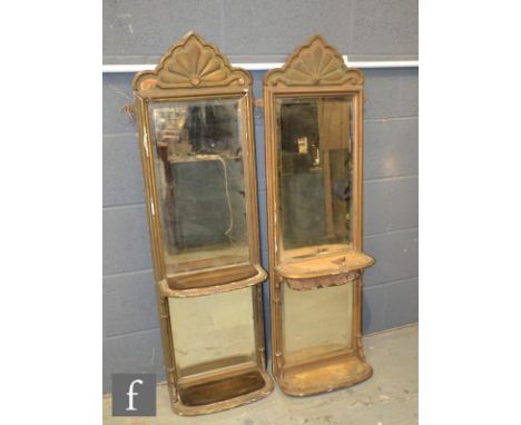 A pair of 19th Century gilt framed pier mirrors, each with a scroll pediment over two bevelled glass panels and with two brac