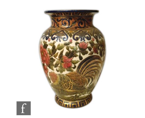 A large early 20th Century Zsolnay Pecs vase decorated with a cockerel amidst pink flowers and foliage with a blue and gilt r