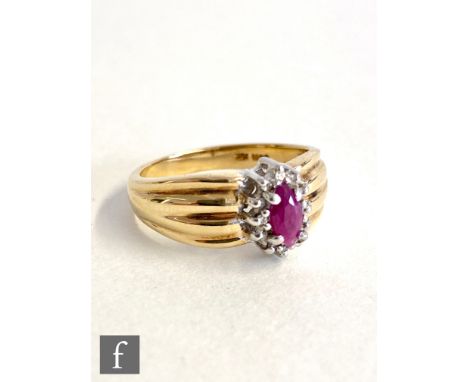 A 9ct ruby and diamond cluster ring, central oval ruby within a diamond surround to a ribbed tapering shank, weight 3.7g, rin