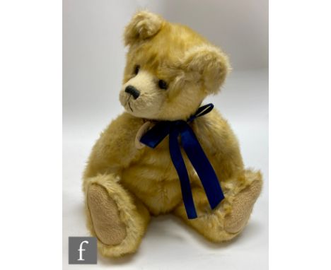 A Charlie Bears Timothy (CB060770) teddy bear, one of the first twelve bears 2006, apricot plush with growler, height 40cm, w