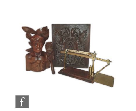 A 19th Century mahogany and brass balance scale with a single barrel weight, also a carved nutcracker of a seated gnome, a Ba