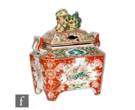 A 19th Century Chinese enamelled censer of rectangular form, raised on pad supports, the reticulated cover with shishi finial