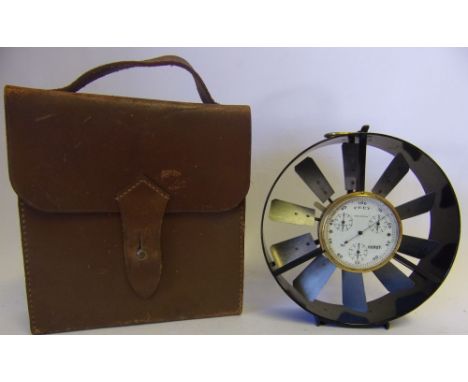 A lacquered brass and anodised metal anemometer: with central gauge and rotating vane, contained in a leather carrying case.