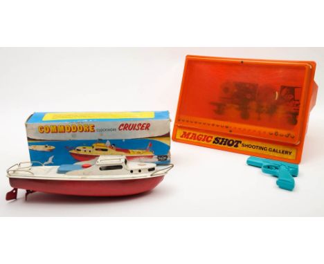A Commodore Clockwork Cruiser in original box together with a magnetic 'Magic Shot Shooting Gallery':, (2)