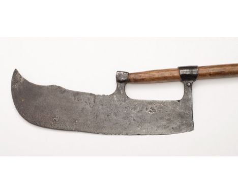 A Scottish Lochaber axe 17th/18th century:, the shaped steel blade with two socket mounts on a wooden haft, 178cm long.