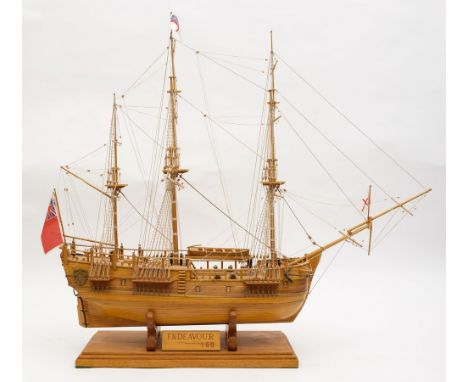 A 1/60th scale model of HMS Endeavour:, standing and running rigged over planked deck with brass cannon, grates and helm, the