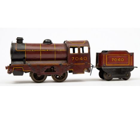 A Wells-Brimtoy No335 clockwork tinplate 0-4-0 locomotive and tender '7040':, in a maroon livery with yellow coach lines.