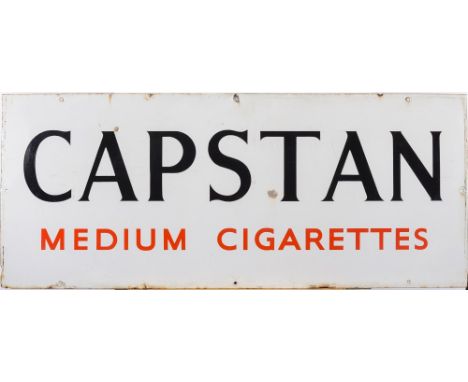 An enamel advertising sign for Capstan Medium cigarettes: red on white - 46cm x 110cm.
