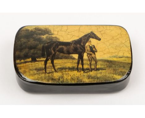 An early 20th century papier mache snuff box with lithograph decorated lid of a stallion and groom:, 5.5cm long.