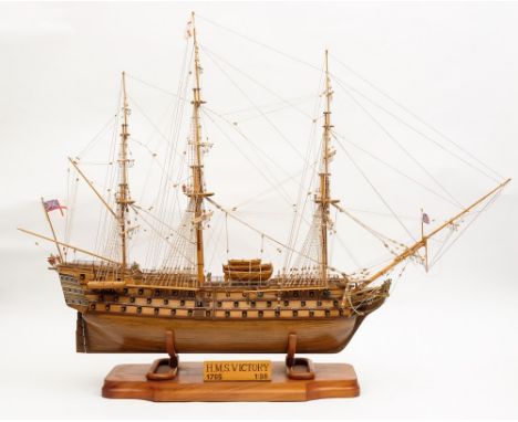 A 1/98th scale model of HMS Victory:, standing and running rigged over detailed decks with lifeboats, turned brass cannons, o