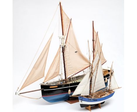 A scale model of a Cornish coaster, and another of a fishing boat:, both fully rigged with detailed decks and painted hull on