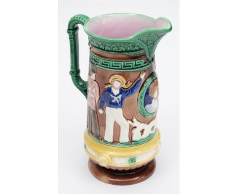 A Victorian majolica jug  'Our Army & Navy & Brave Volunteers':, moulded with military figures either side of a cameo of a wo