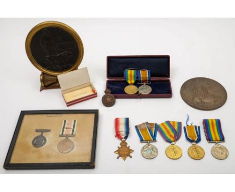 Two WWI memorial plaques:, one with a trio of medals to '3793 Pte K R Graham 16 Lond R', the other with a pair to T R W Cable