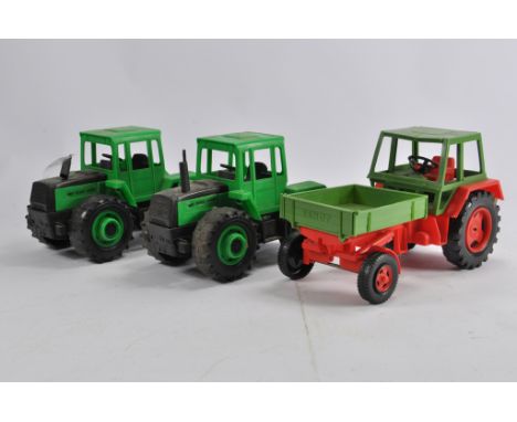 Trio of older Bruder Tractor Models including MB Trac x 2 and a Fendt Tool Carrier. G to E. (3)