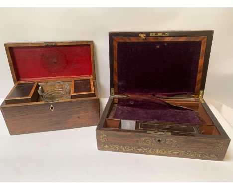 A 19th/20th century stained oak rectangular tea caddy, the hinged lid opening to two compartments with inlaid lids, and centr