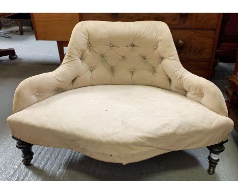A 19th century corner seat, with shaped and button back, shaped arms, shaped front, on four ebonised legs, the front legs wit