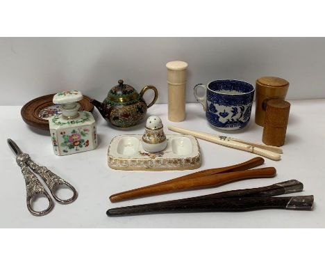 An early 20th century silver mounted glove stretcher, two other glove stretchers, a Maucheline ware shot glass holder and sho