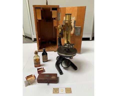 A W &amp; H Seibert Wetzlar microscope, together with various accessories; all cased in a pine carrying box with applied labe